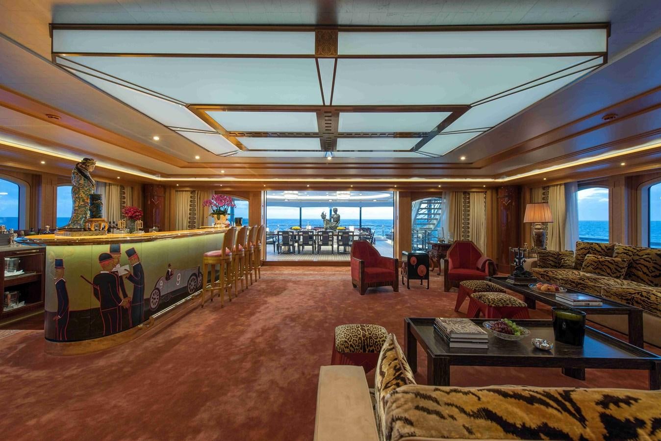 a large room with a large screen aboard AURORA Yacht for Sale