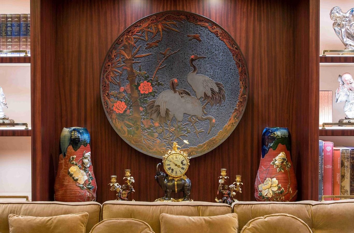 a clock on a wall aboard AURORA Yacht for Sale