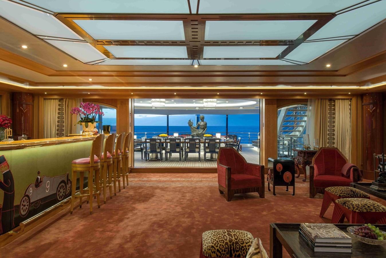 a large room with chairs and tables aboard AURORA Yacht for Sale