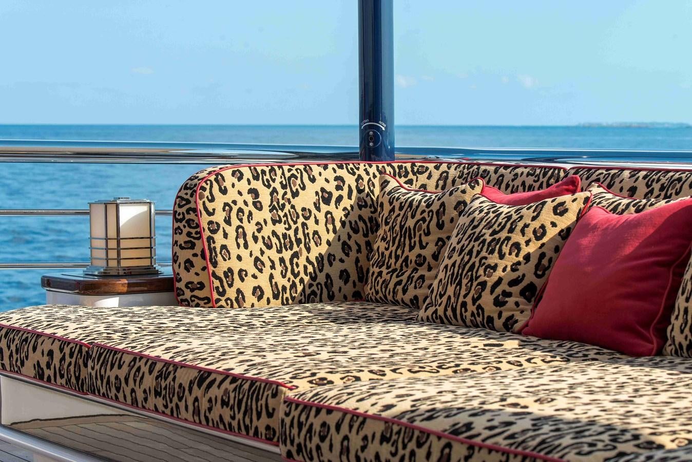 a bed with pillows on it aboard AURORA Yacht for Sale