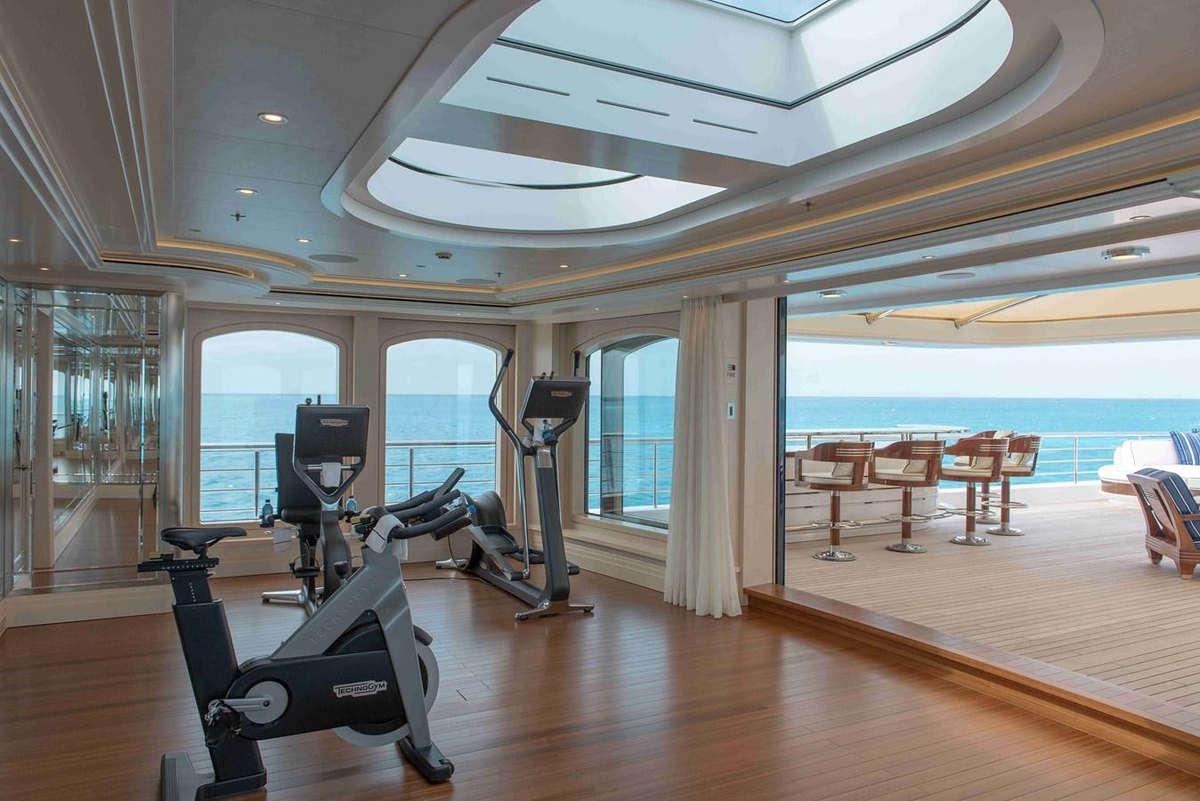 a room with a large window and a view of the water aboard AURORA Yacht for Sale