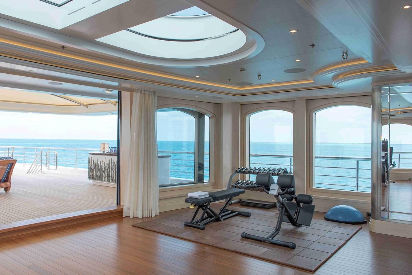 a room with a table and chairs aboard AURORA Yacht for Sale