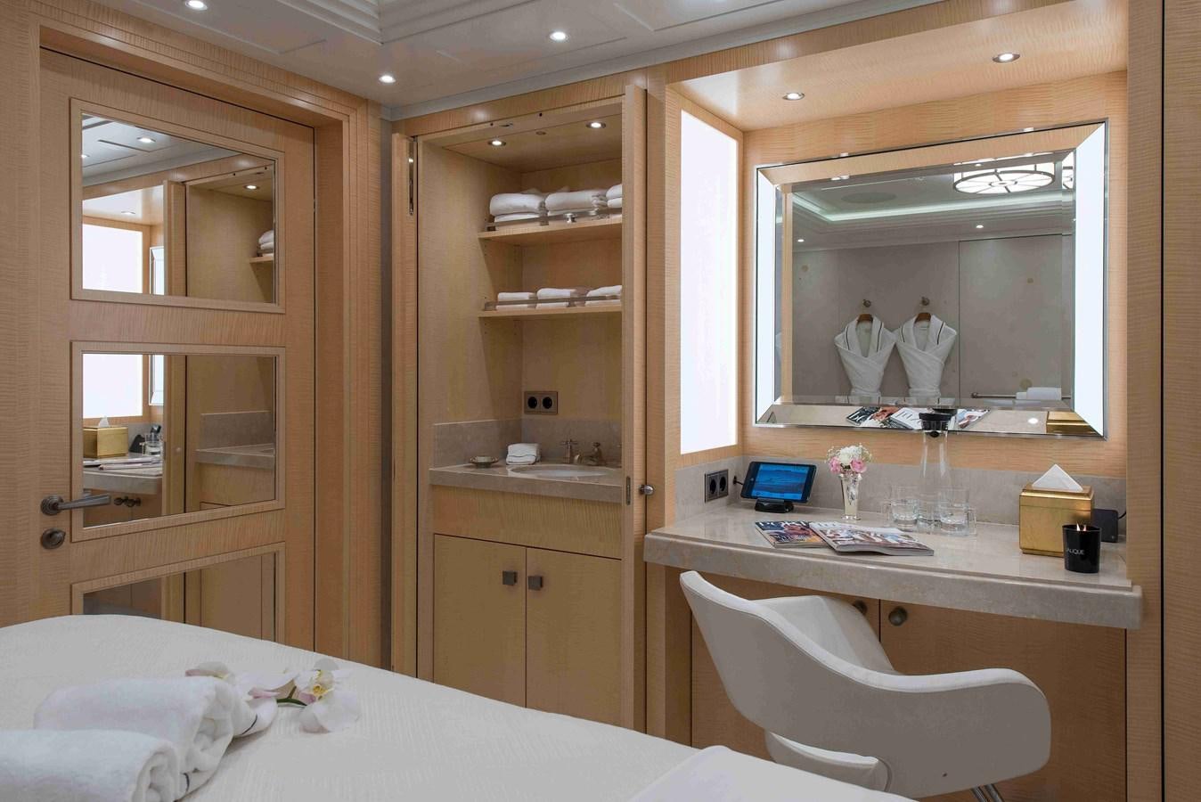 a room with a mirror and a bed aboard AURORA Yacht for Sale