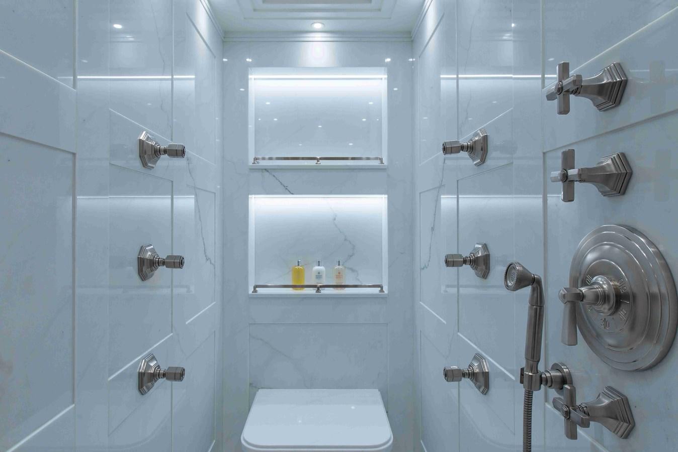 a bathroom with a toilet and a sink aboard AURORA Yacht for Sale