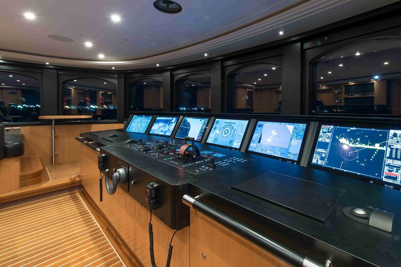 a control room with many monitors aboard AURORA Yacht for Sale