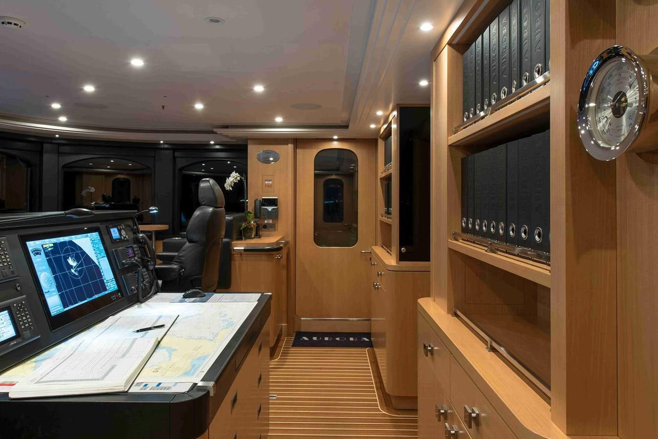a room with a desk and a tv aboard AURORA Yacht for Sale