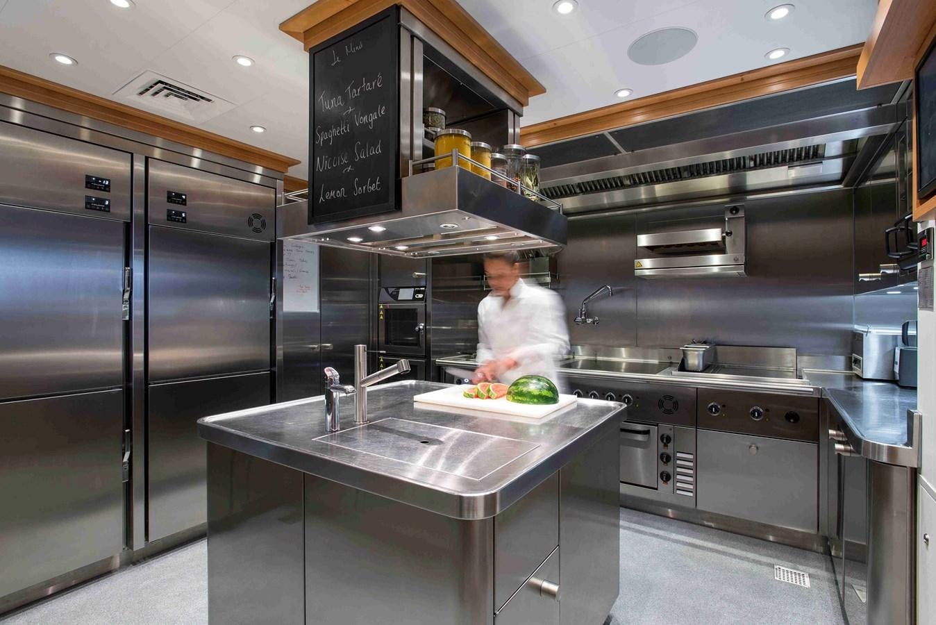 a chef in a kitchen aboard AURORA Yacht for Sale