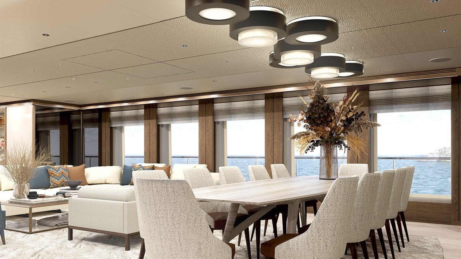 a room with white chairs and a table with a plant in it aboard HEESEN 55M STEEL YN 20955  AGNETHA Yacht for Sale