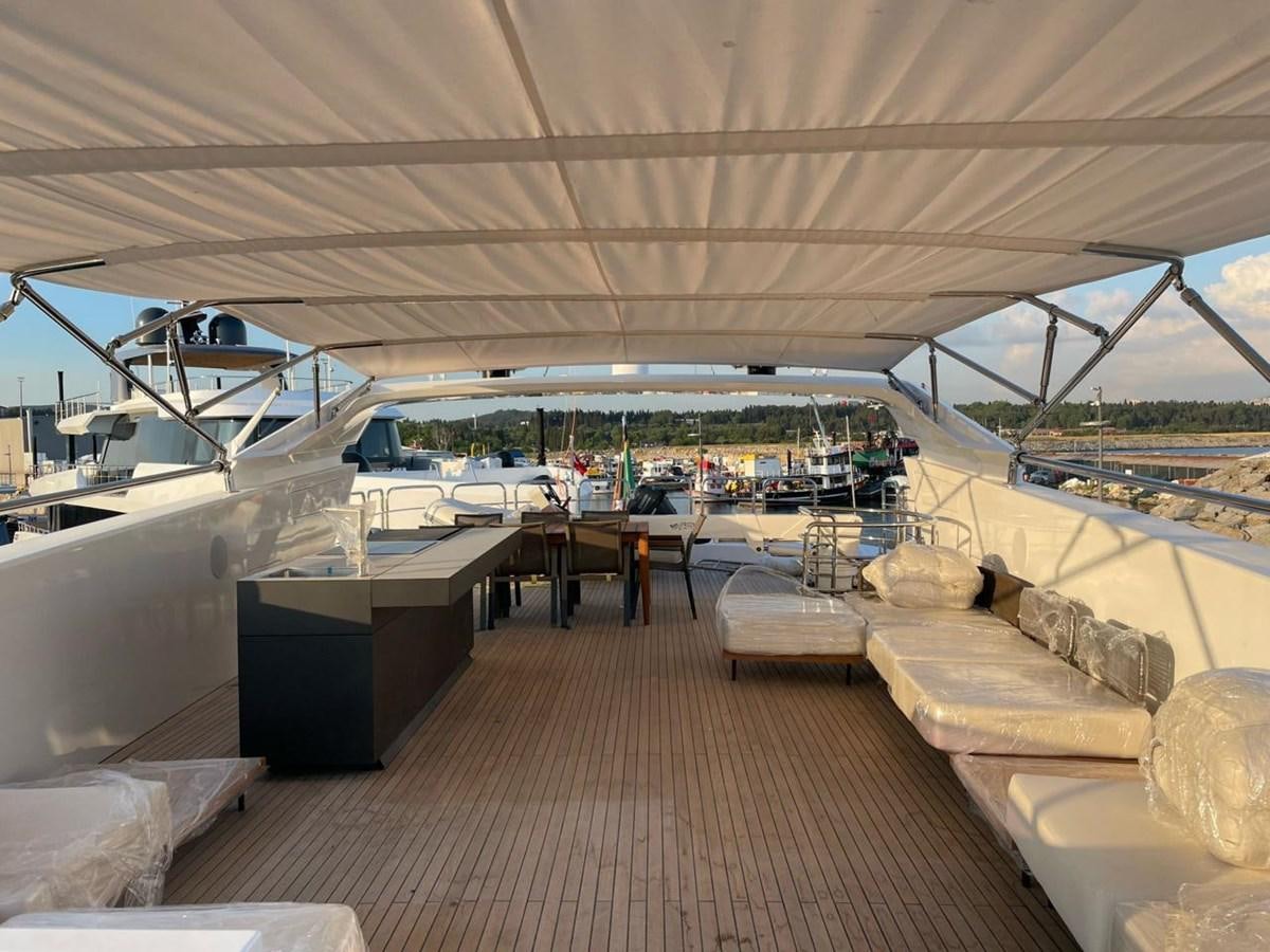 a large room with a large deck and a large boat in the water aboard BLUEY Yacht for Sale