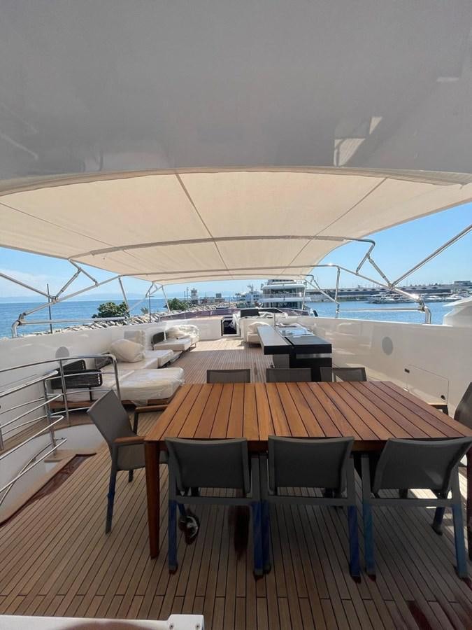 a table with chairs on it aboard BLUEY Yacht for Sale