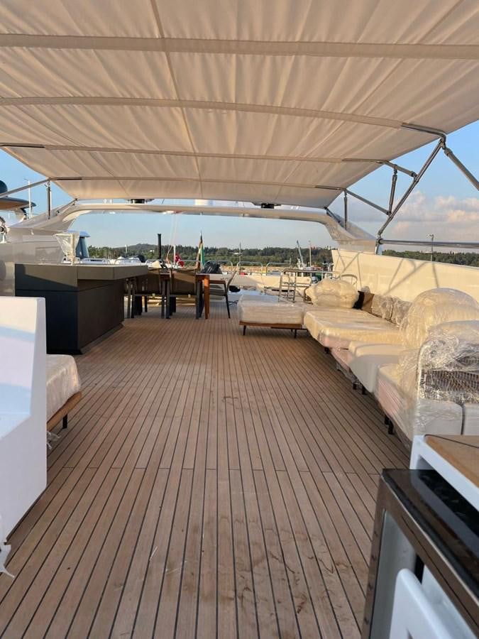 a room with a bed and a couch aboard BLUEY Yacht for Sale