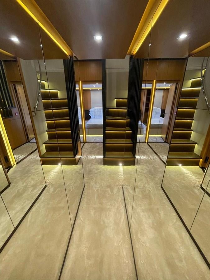 a hallway with glass doors aboard BLUEY Yacht for Sale