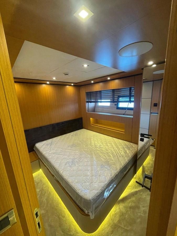 a bed in a room aboard BLUEY Yacht for Sale