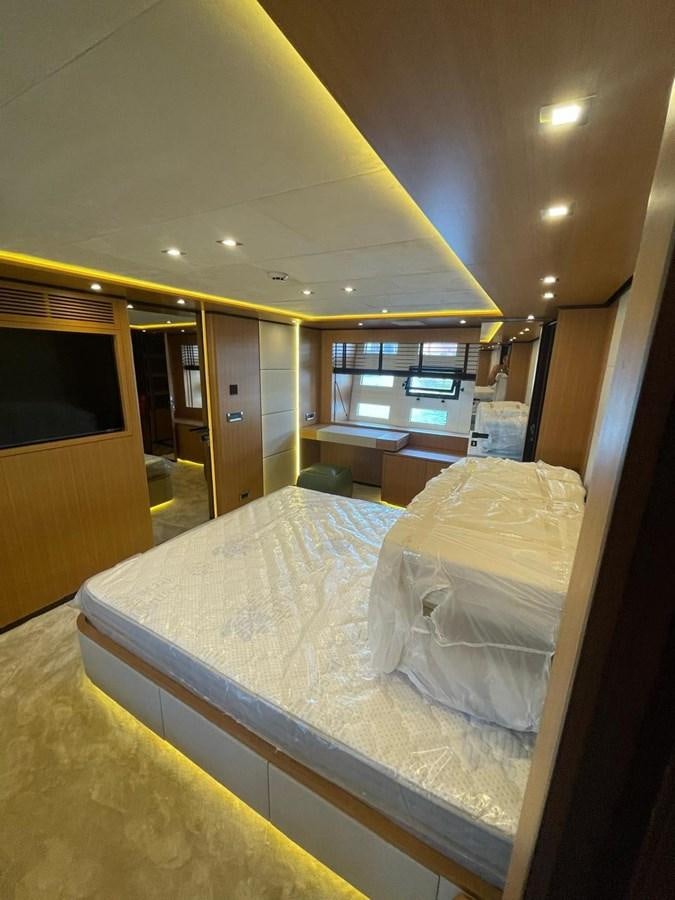 a room with a bed and a desk aboard BLUEY Yacht for Sale