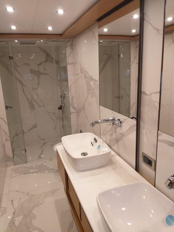 a bathroom with a sink and a shower aboard BLUEY Yacht for Sale