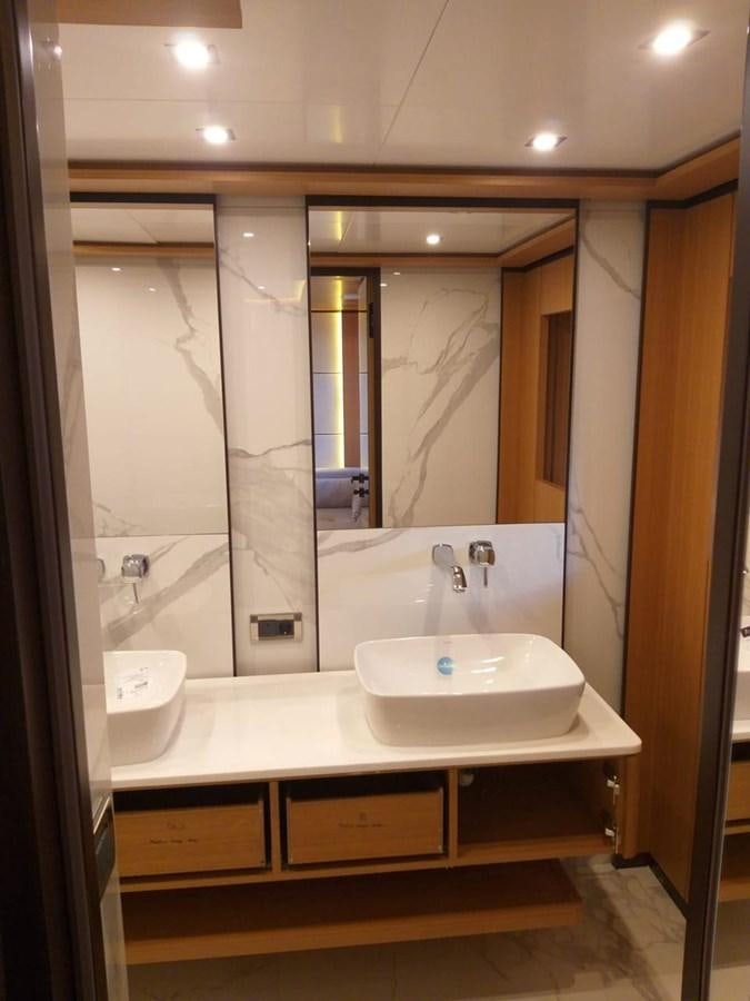 a bathroom with a large mirror aboard BLUEY Yacht for Sale