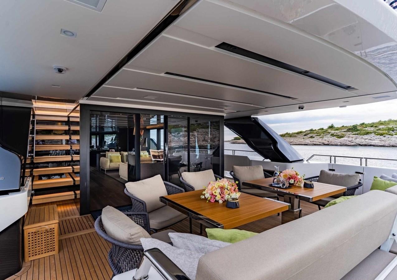 a living room with a large glass window aboard ASYMMETRIC Yacht for Sale