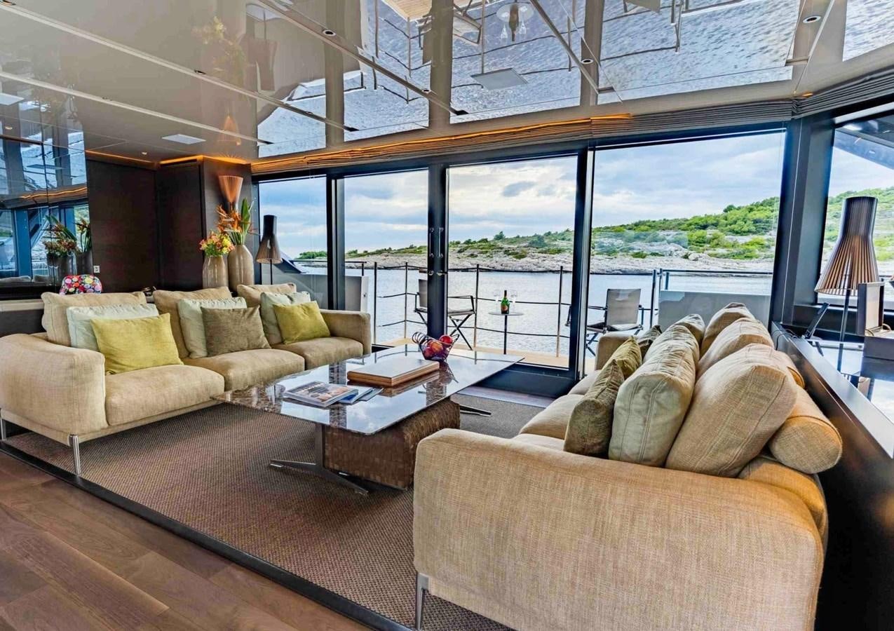 a living room with a large window aboard ASYMMETRIC Yacht for Sale