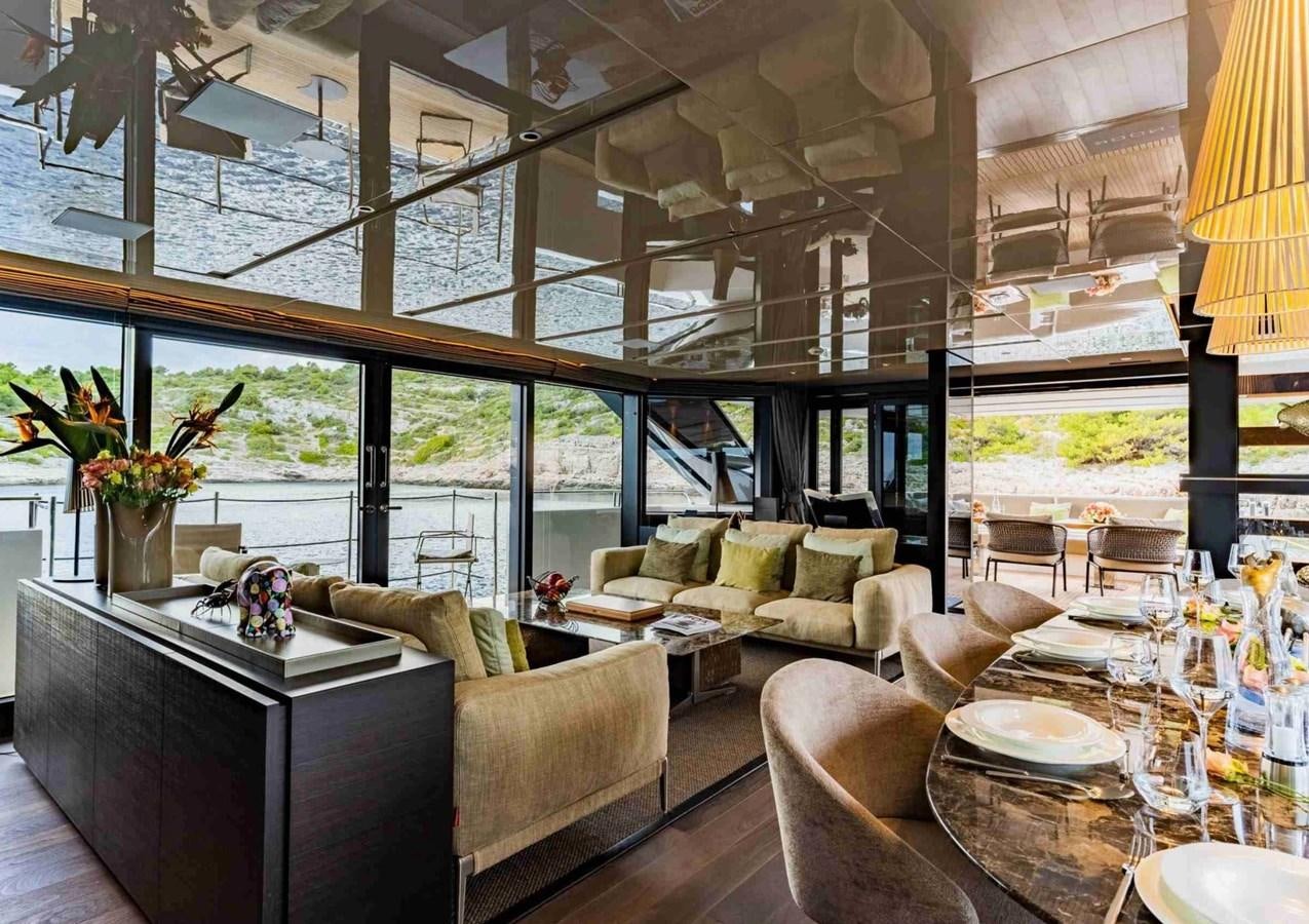 a living room with a large window aboard ASYMMETRIC Yacht for Sale