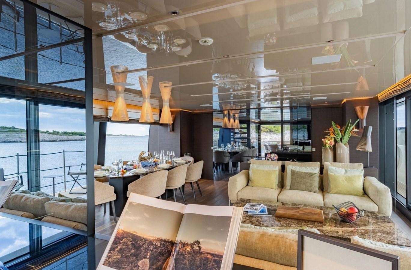 a living room with a large window aboard ASYMMETRIC Yacht for Sale