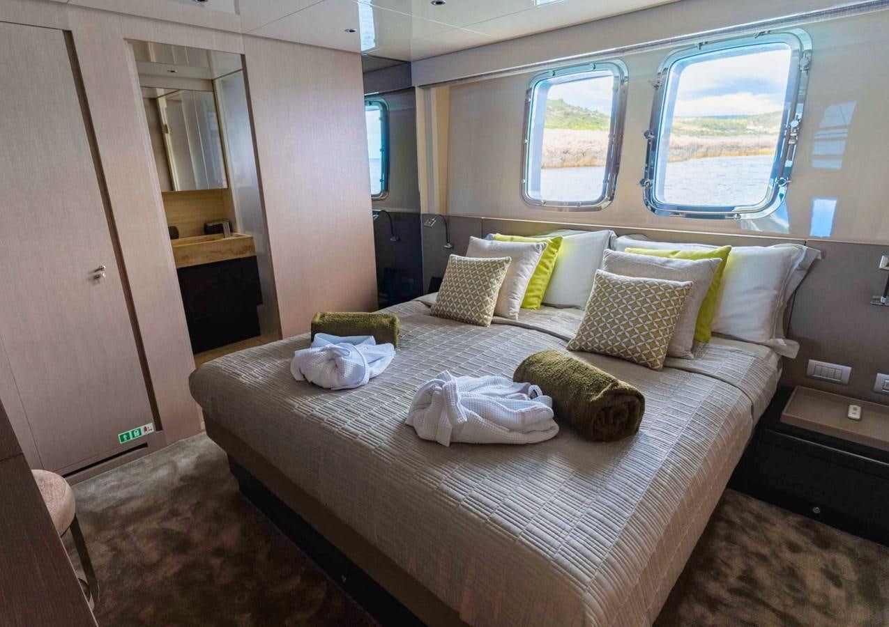 a bed with pillows on it aboard ASYMMETRIC Yacht for Sale