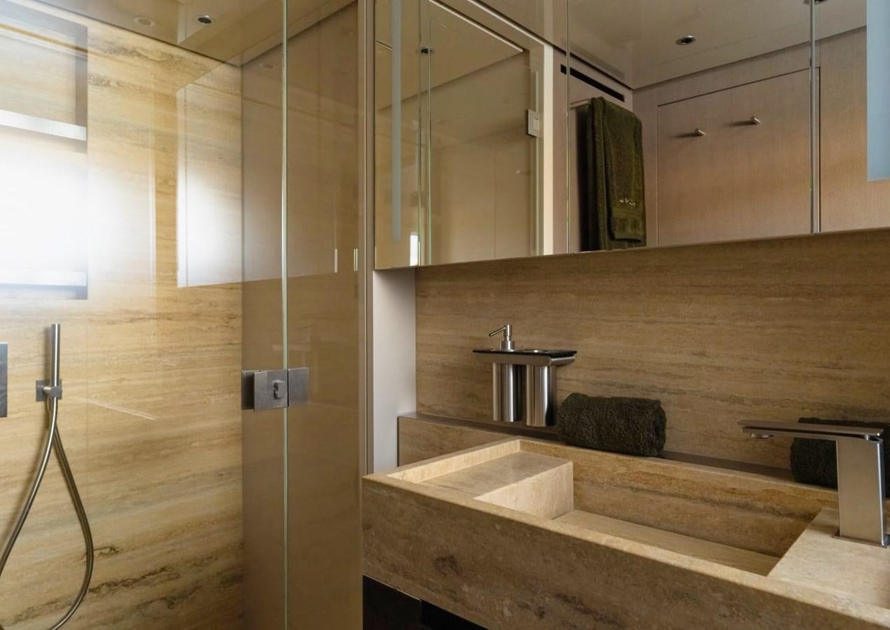a bathroom with a glass shower aboard ASYMMETRIC Yacht for Sale