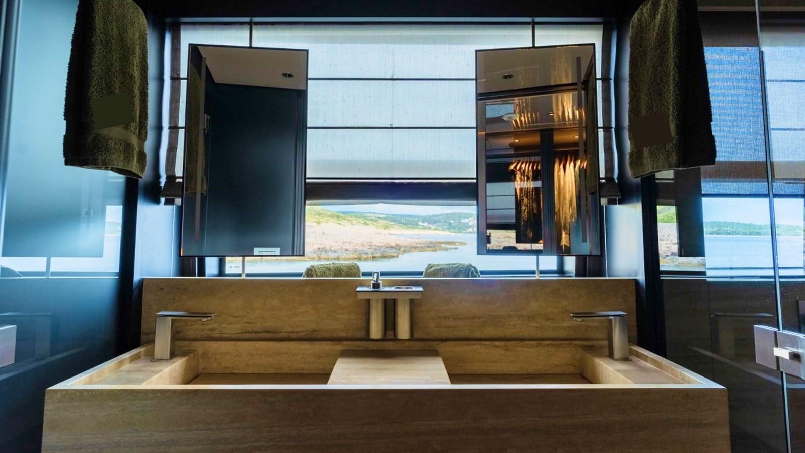 a room with a large window and a bench aboard ASYMMETRIC Yacht for Sale