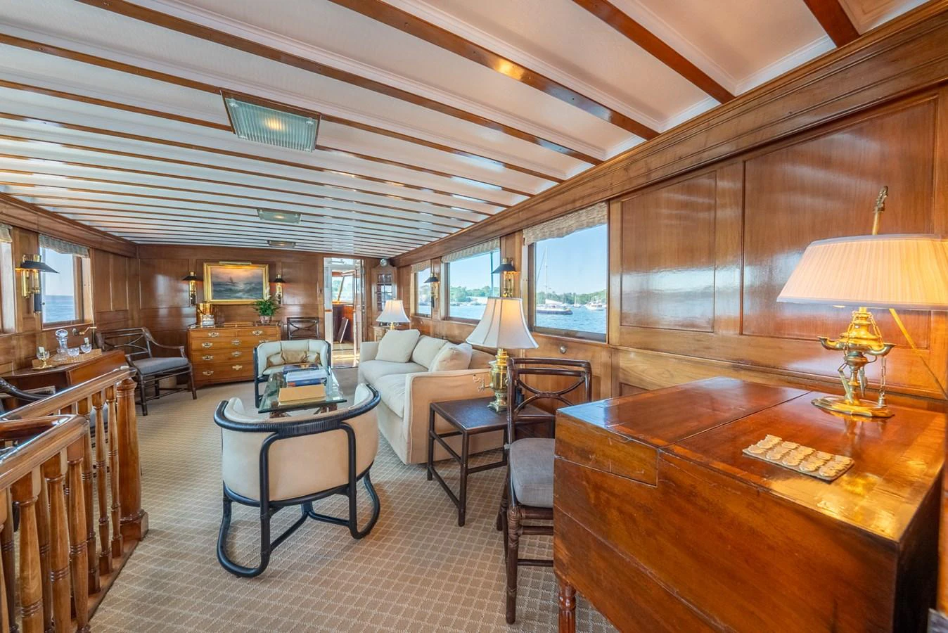 a room with a table chairs and a large window aboard BERNADETTE Yacht for Sale