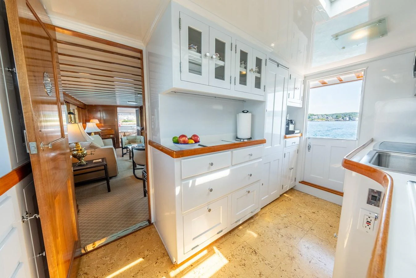 a kitchen with white cabinets aboard BERNADETTE Yacht for Sale