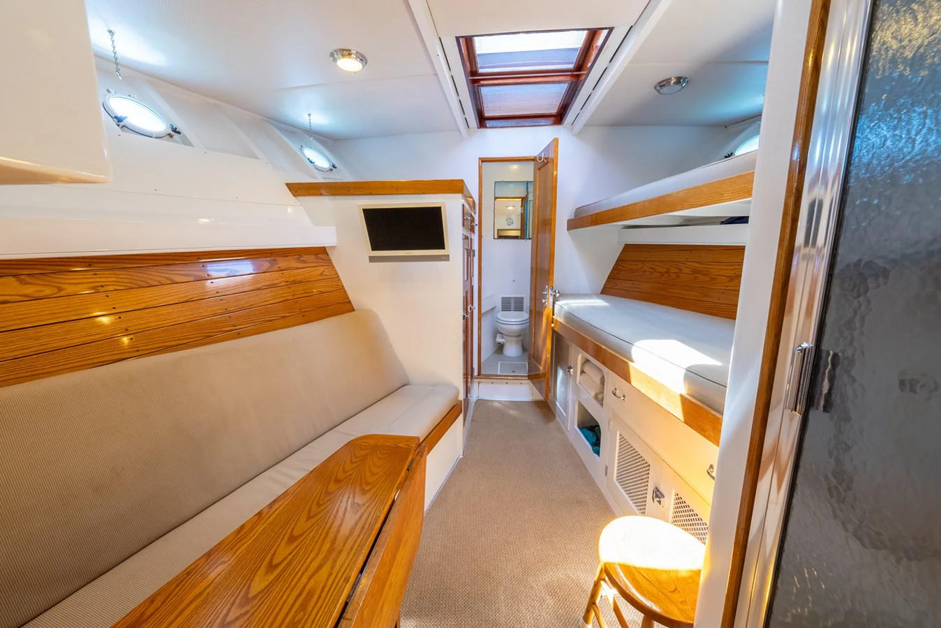 a room with a bed and a desk aboard BERNADETTE Yacht for Sale