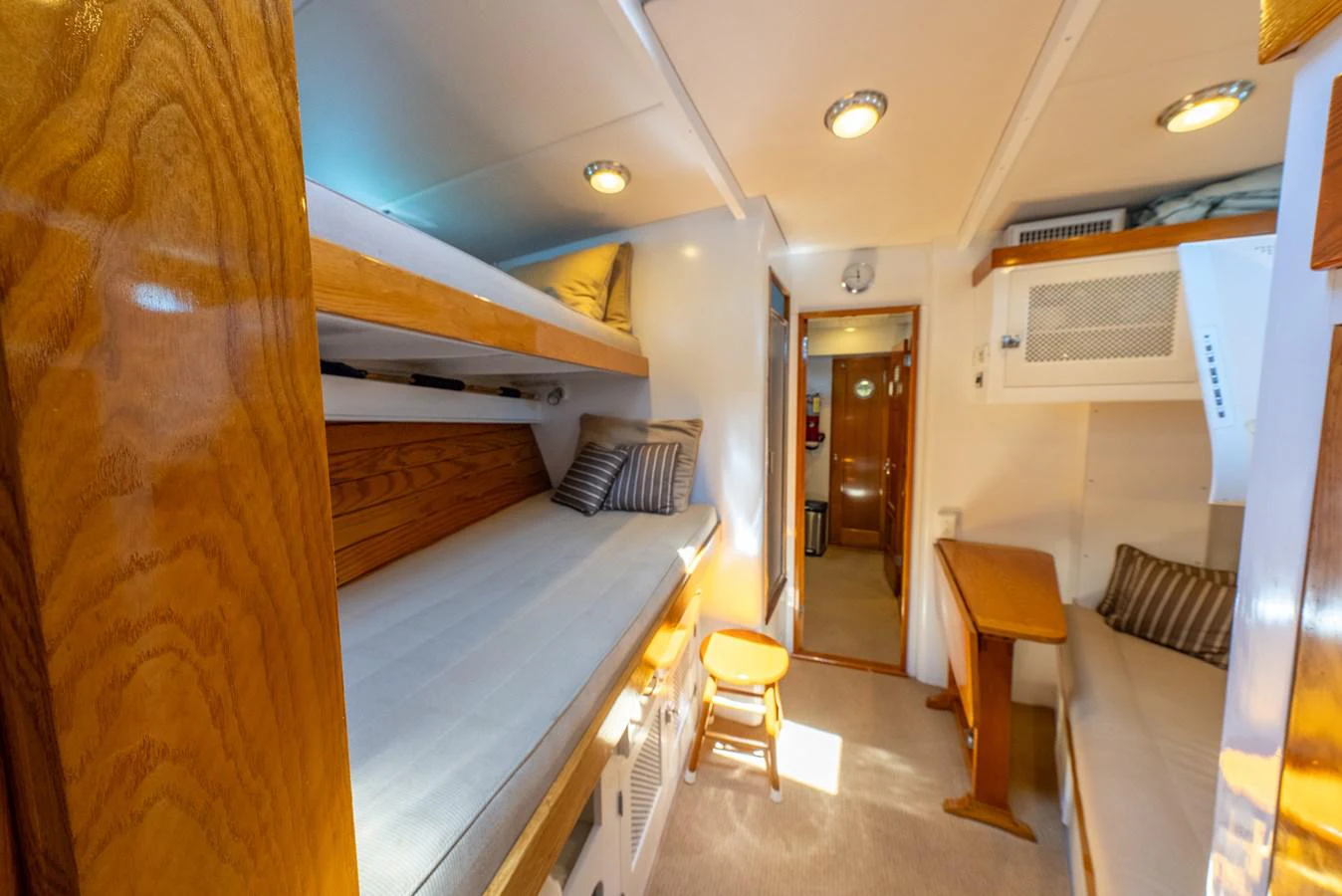 a room with a bed and a table aboard BERNADETTE Yacht for Sale