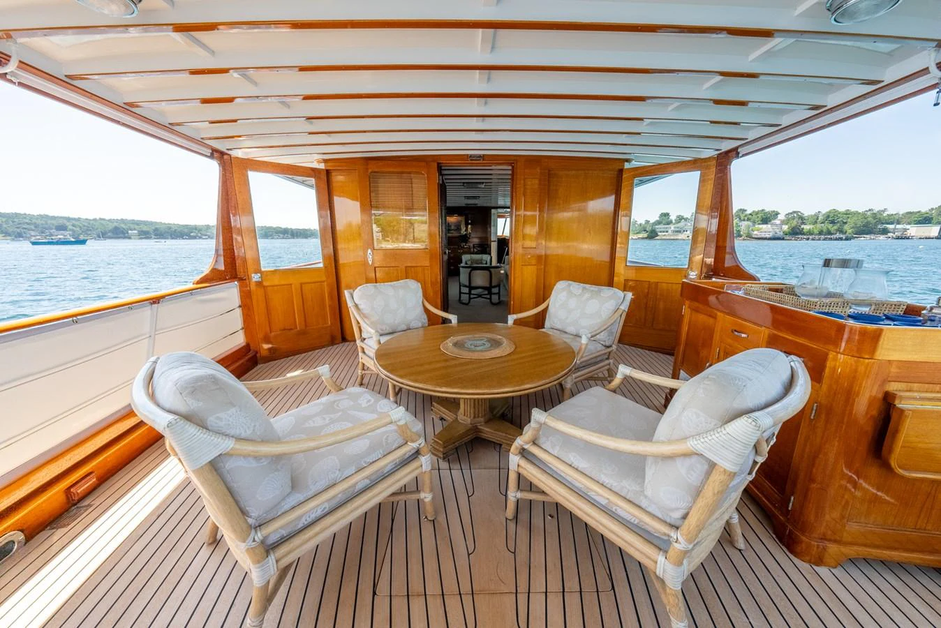 a table and chairs on a boat aboard BERNADETTE Yacht for Sale
