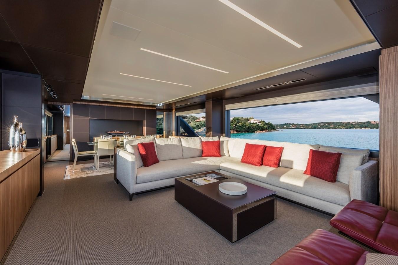 a living room with a couch and a table aboard IRON GRYPHON Yacht for Sale