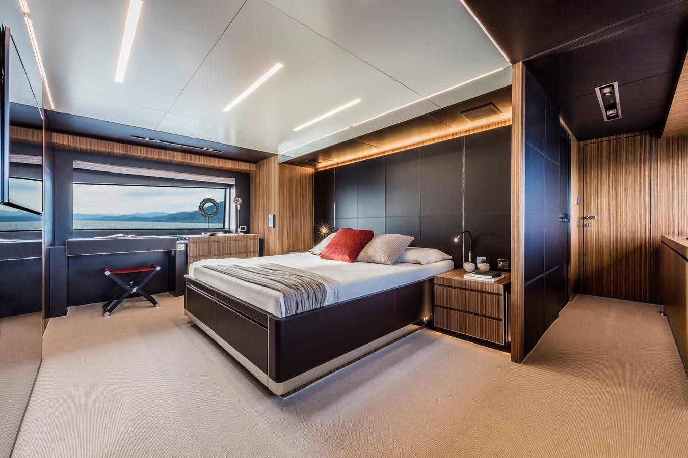 a large bedroom with a large bed aboard IRON GRYPHON Yacht for Sale