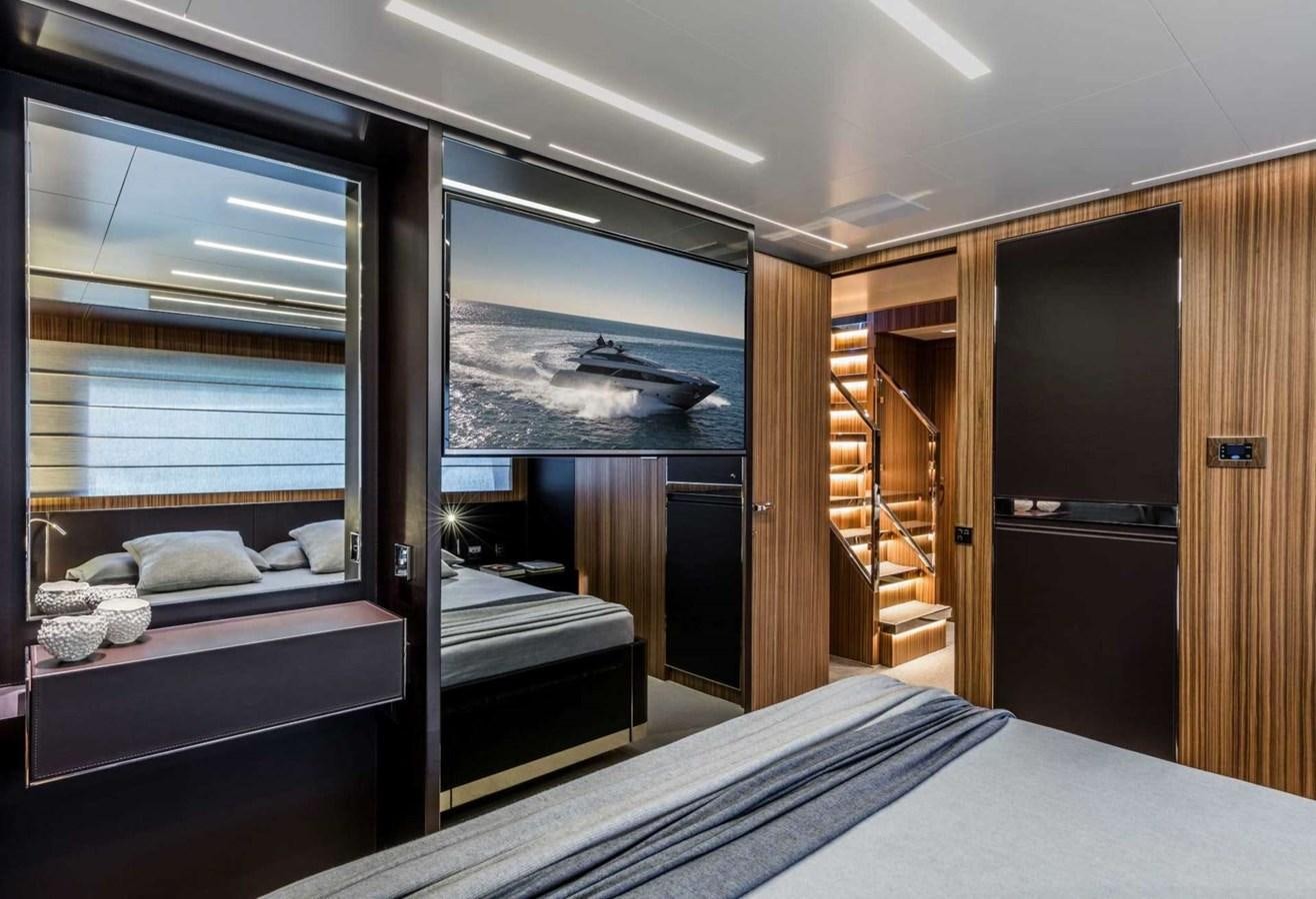 a room with a bed and a window aboard IRON GRYPHON Yacht for Sale