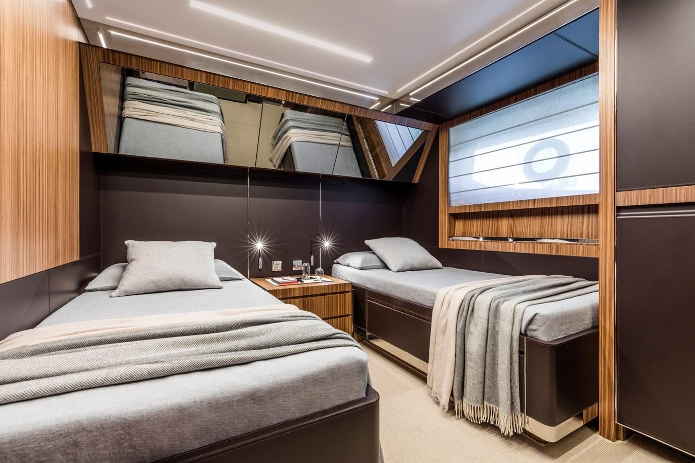 a room with two beds aboard IRON GRYPHON Yacht for Sale