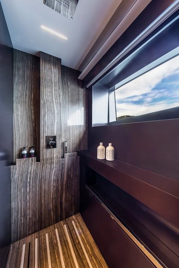 a wood floor with a wood wall and a window with a wood floor aboard IRON GRYPHON Yacht for Sale