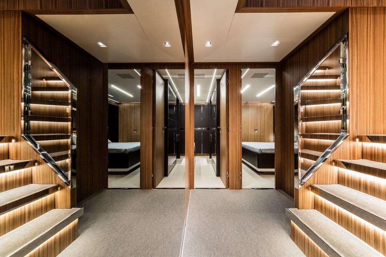 a room with wooden walls and a staircase aboard IRON GRYPHON Yacht for Sale