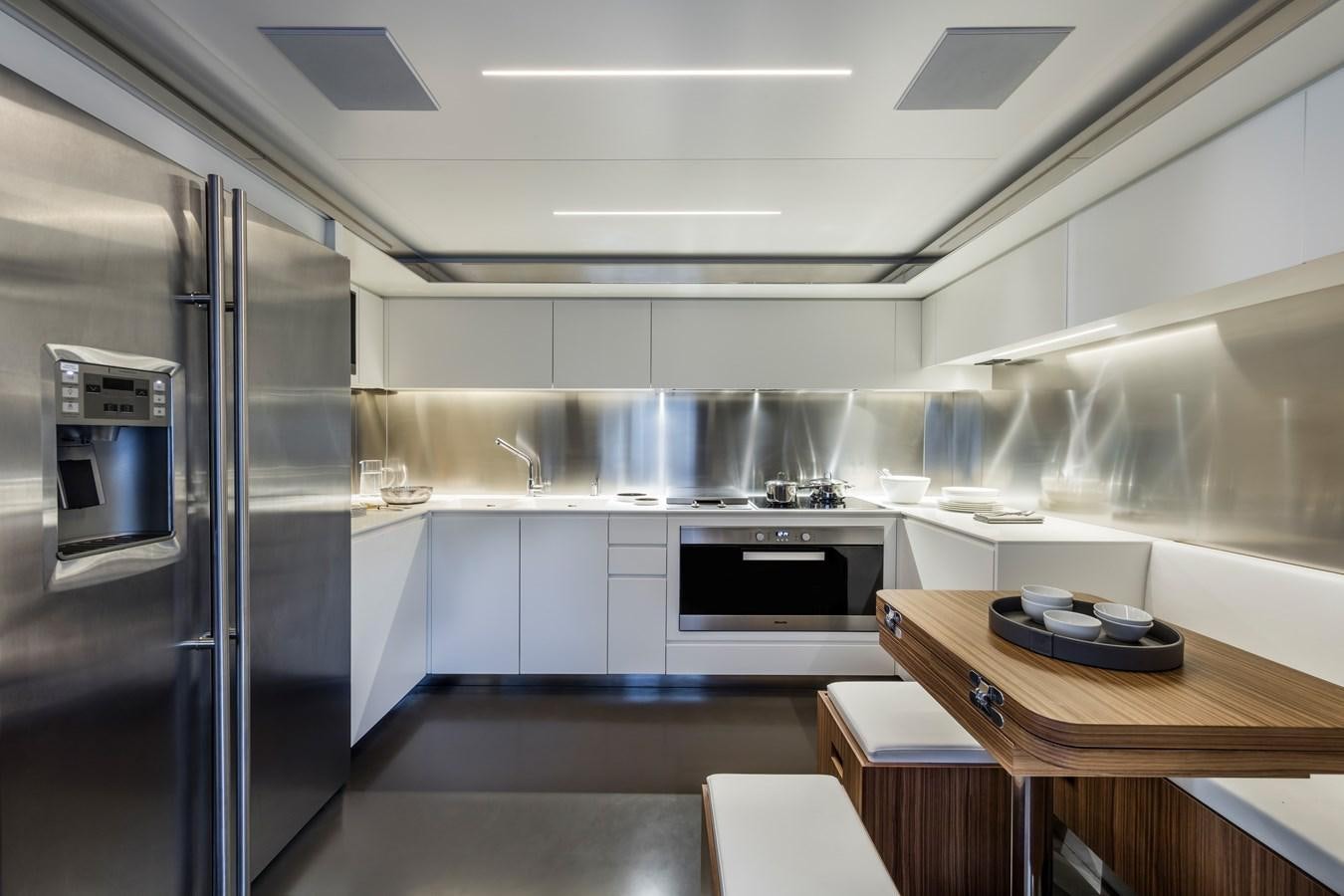 a kitchen with a glass door aboard IRON GRYPHON Yacht for Sale