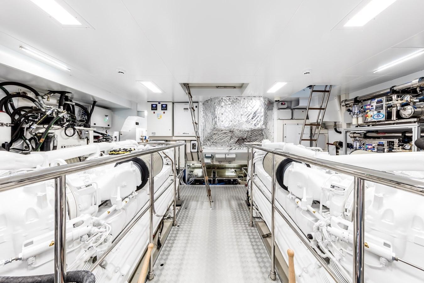 a room with white cabinets and shelves aboard IRON GRYPHON Yacht for Sale