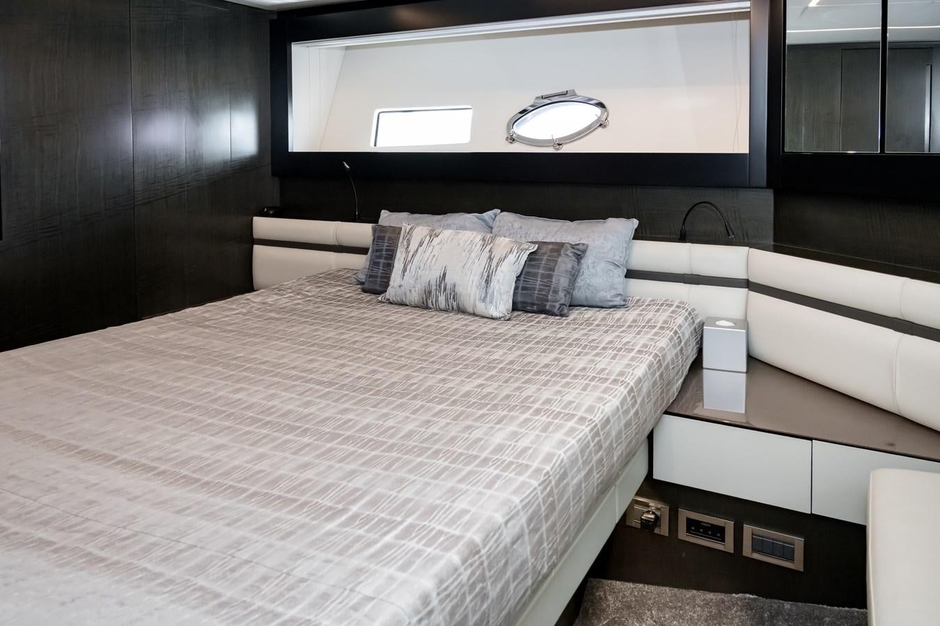 a bed with a white sheet aboard QUEEN B SPORT Yacht for Sale