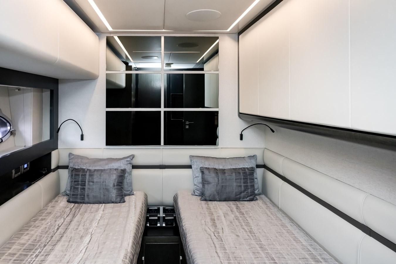 a room with two beds aboard QUEEN B SPORT Yacht for Sale
