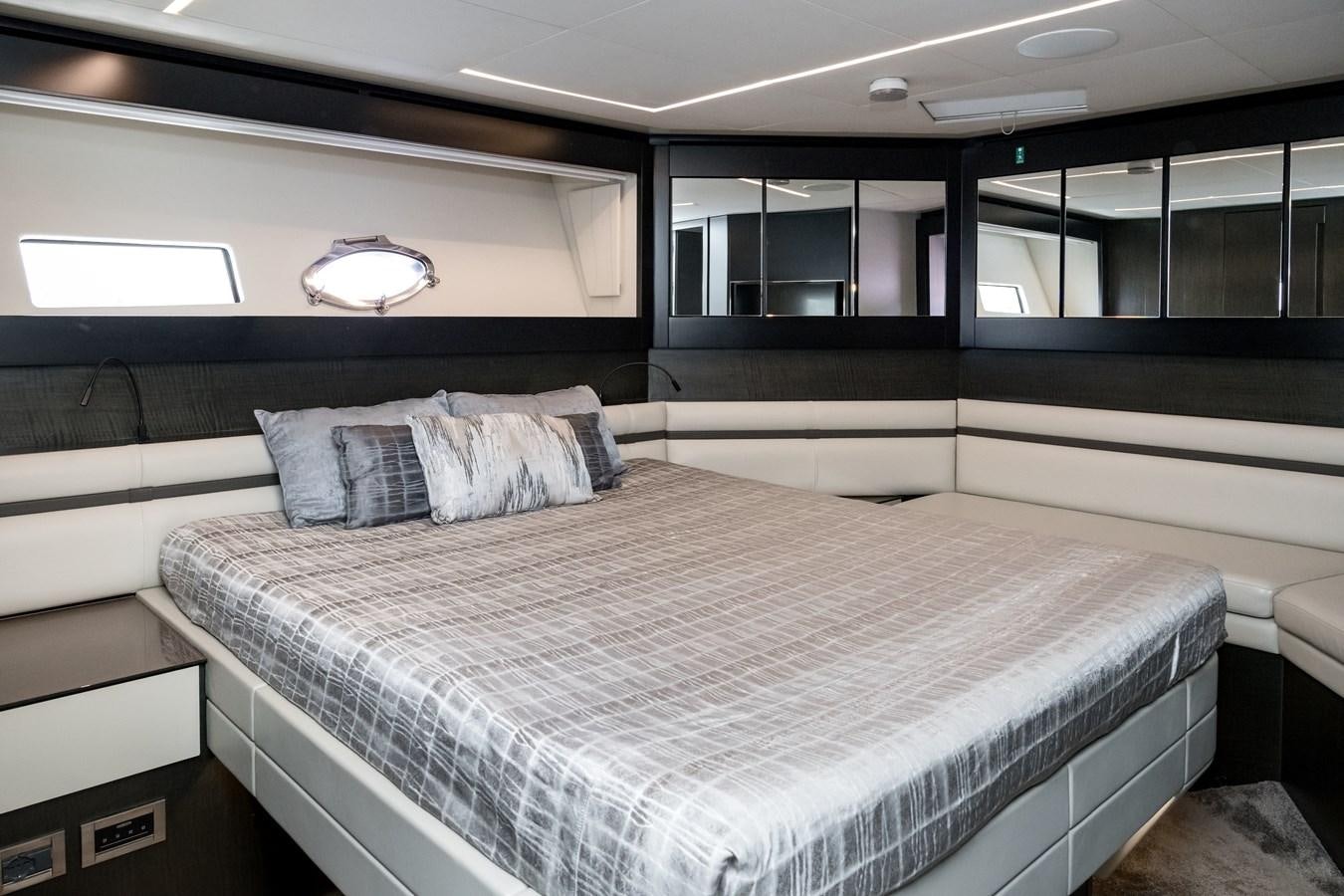 a bed in a room aboard QUEEN B SPORT Yacht for Sale