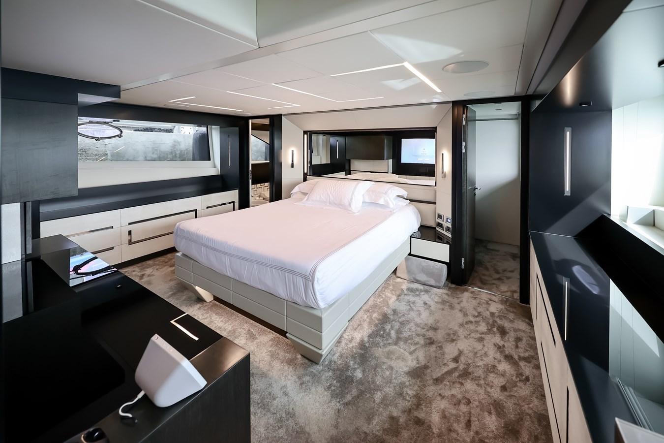 a room with a bed and a tv aboard QUEEN B SPORT Yacht for Sale