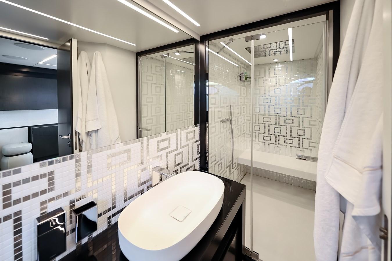 a bathroom with a toilet and a bathtub aboard QUEEN B SPORT Yacht for Sale