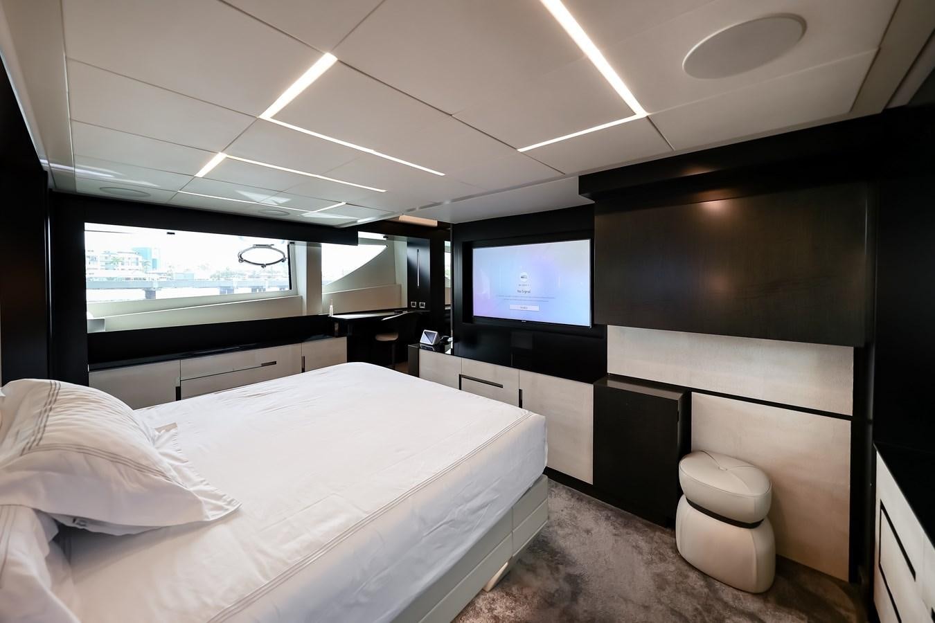 a room with a bed and a tv aboard QUEEN B SPORT Yacht for Sale
