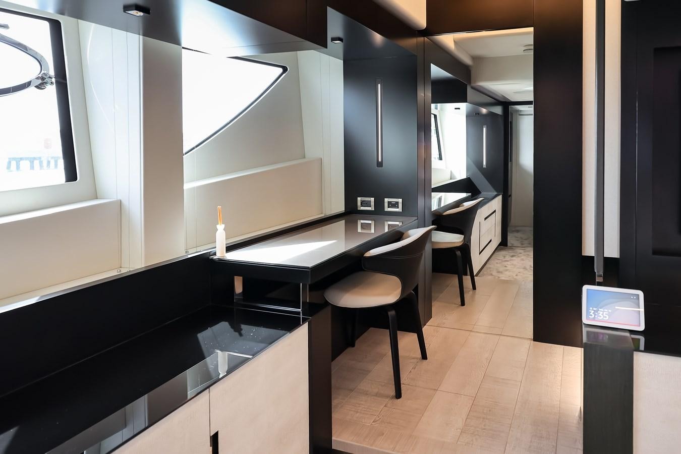 a room with a table and chairs aboard QUEEN B SPORT Yacht for Sale