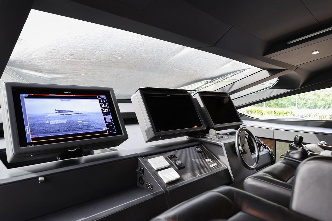 a car with computers on the dashboard aboard QUEEN B SPORT Yacht for Sale