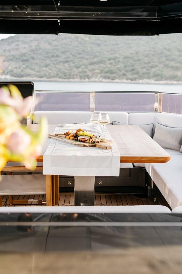 a table with food on it aboard BERING 70 LEVANNA Yacht for Sale