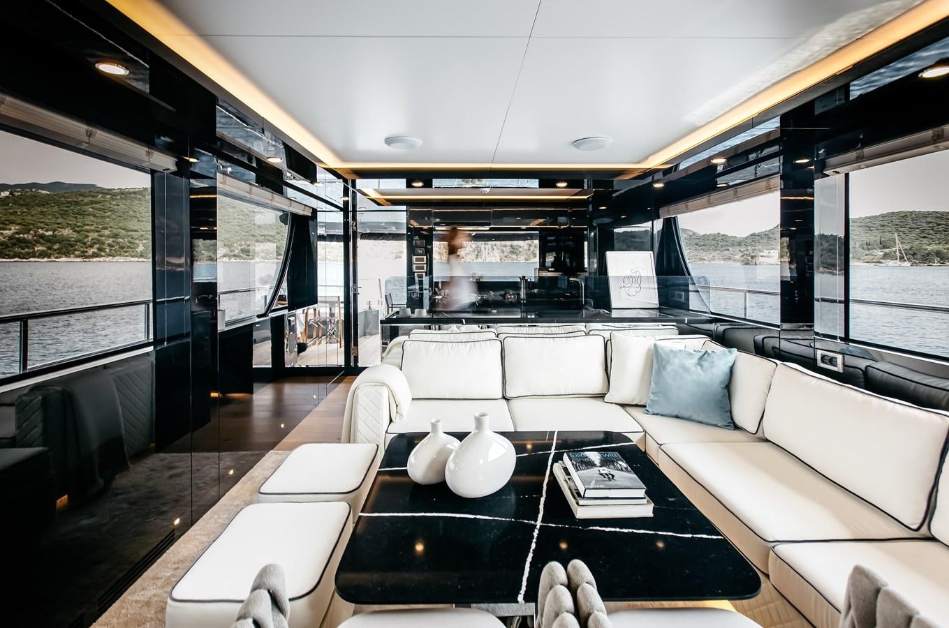 inside of a building with a table and chairs aboard BERING 70 LEVANNA Yacht for Sale